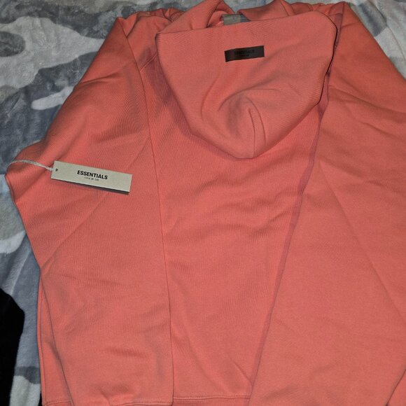 Fear of God Essentials Hoodie in Coral—a standout, soft-pink hue unisex oversize - Picture 4 of 5